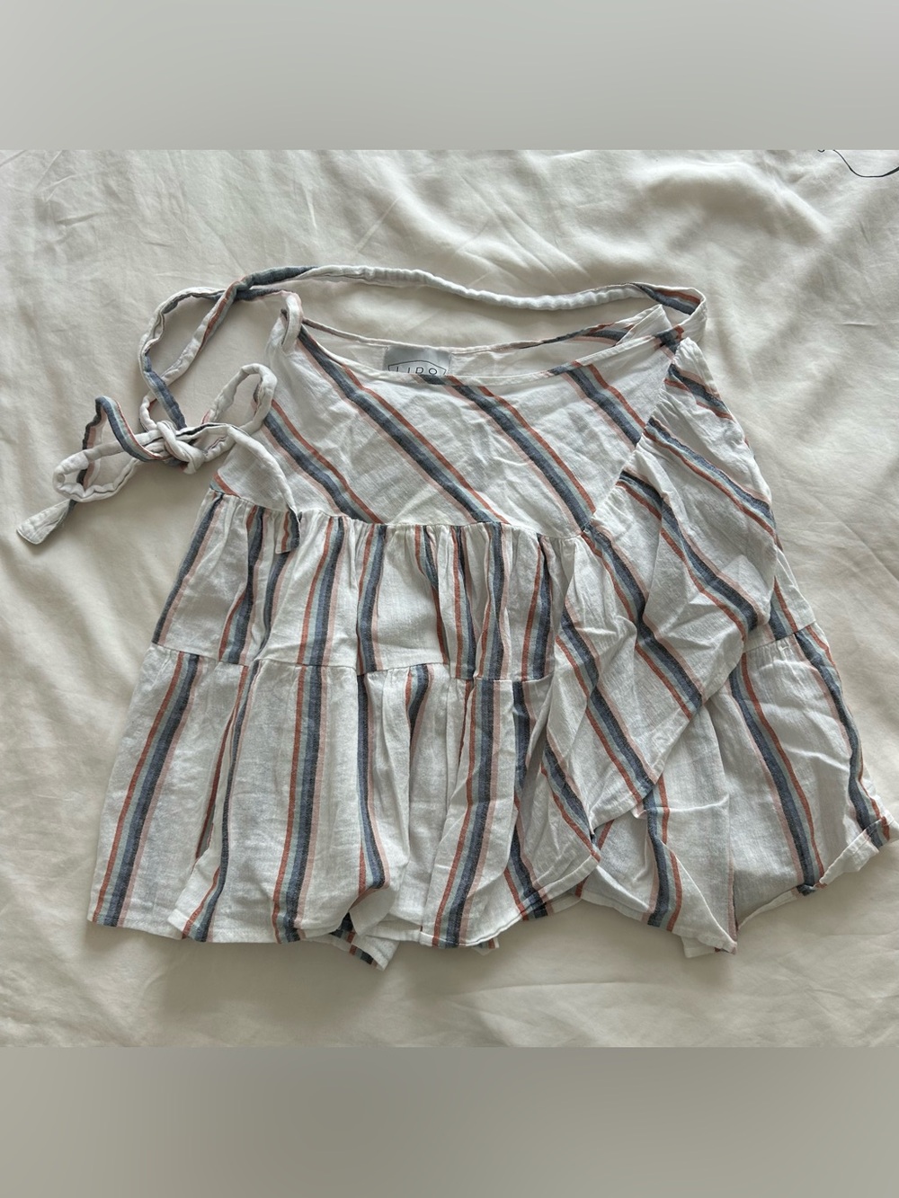 Lido white striped linen mini wrap skirt with ruffles and adjustable tie